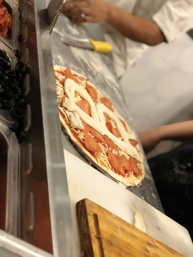 Bitcoin Pizza Day 2018 - Fresh Bitcoin pizza with phone to check logo