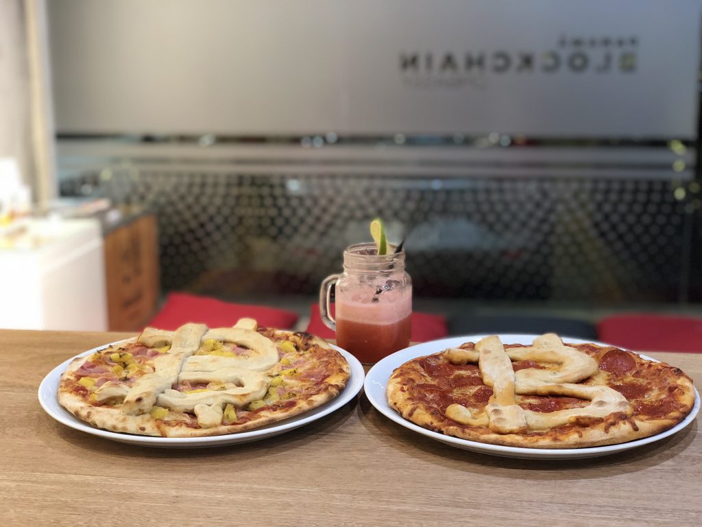 Bitcoin Pizza Day 2018 - Pizzas side by side and the outside logo